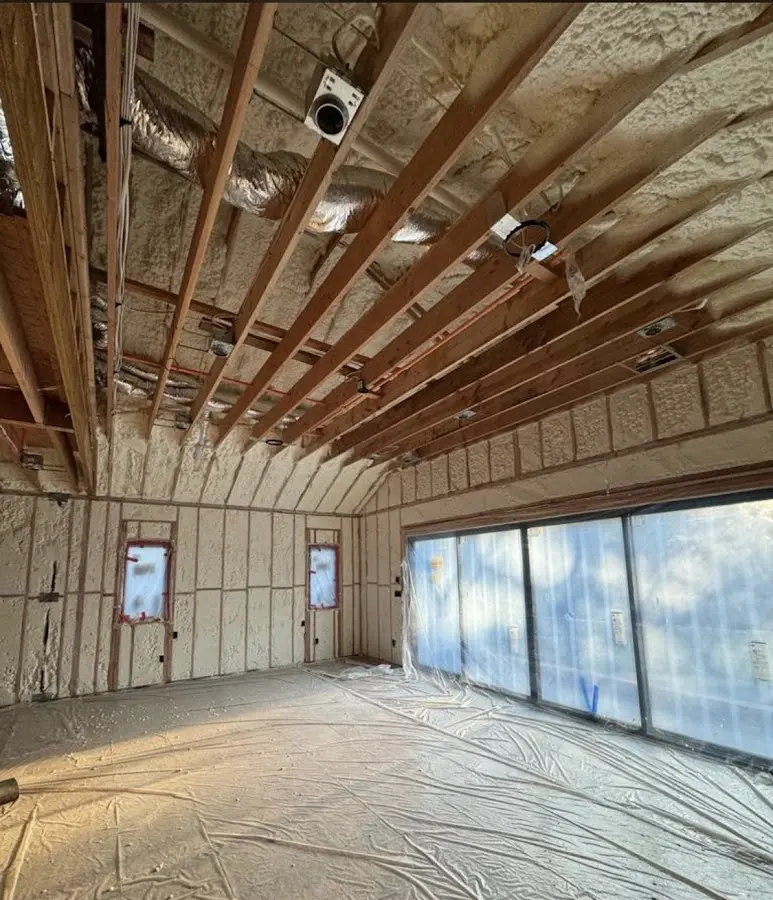 Interior walls and ceiling insulated with spray foam during new construction in Laurinburg